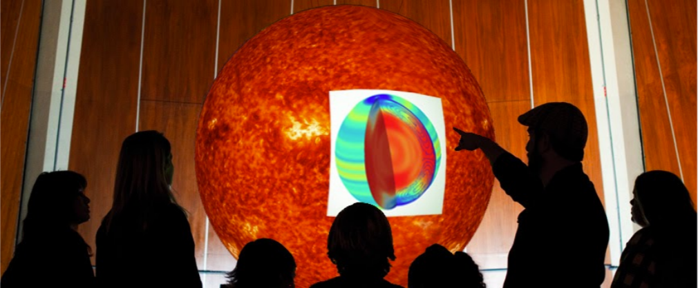 John Erickson discussing a solar image on an SOS display.